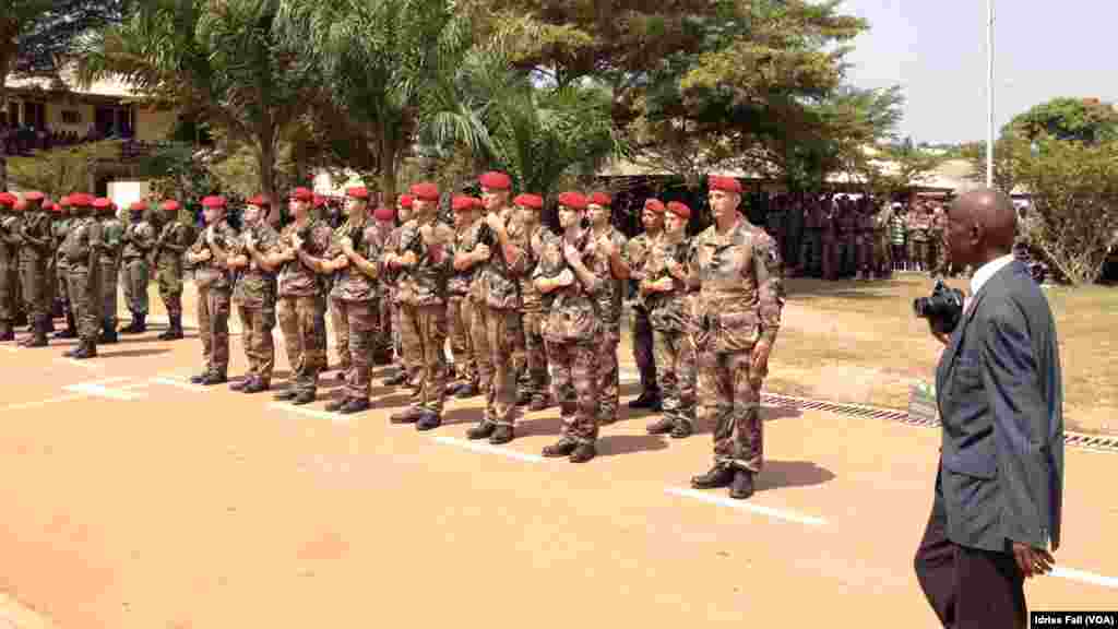 A Tibetan boy points a toy gun towards a girl during the function to mark "Losar" or the Tibetan New Year at a Tibetan Refugee Camp in Lalitpur, Nepal.