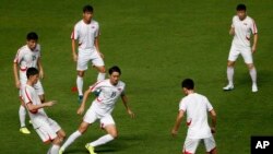 FILE - The North Korea national soccer team players train for the Asian Cup qualifiers, in Buriram province, Thailand, Nov. 9, 2017.