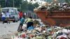 Children sift through garbage at a dump site in Harare, February 21, 2011 (File photo)