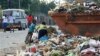 Children sift through garbage at a dump site in Harare, Zimbabwe, on President Robert Mugabe's 87th birthday, February 21, 2011 (File photo)