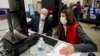 Democratic and Republican representatives review absentee ballots at the Fulton County Election preparation Center, Nov. 4, 2020 in Atlanta. 