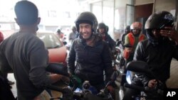 Nepalese wait in line at a gas station in Kathmandu, Nepal, Tuesday, Feb. 23, 2016.