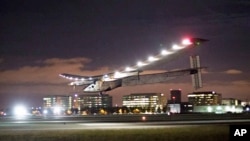 FILE - In this April 23, 2016 file photo, Solar Impulse 2 lands at Moffett Field in Mountain View, Calif., completing the leg of its journey from Hawaii in its attempt to circumnavigate the globe. 