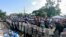 FILE - Police form a cordon outside a church where a Mass is celebrated for the freedom of political prisoners, in Masaya, Nicaragua, Aug. 28, 2019. 