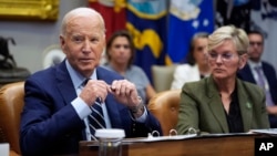 President Joe Biden delivers remarks on the federal government's response to Hurricane Helene and preparations for Hurricane Milton in the Roosevelt Room of the White House, Oct. 8, 2024, as Secretary of Energy Jennifer Granholm looks on.