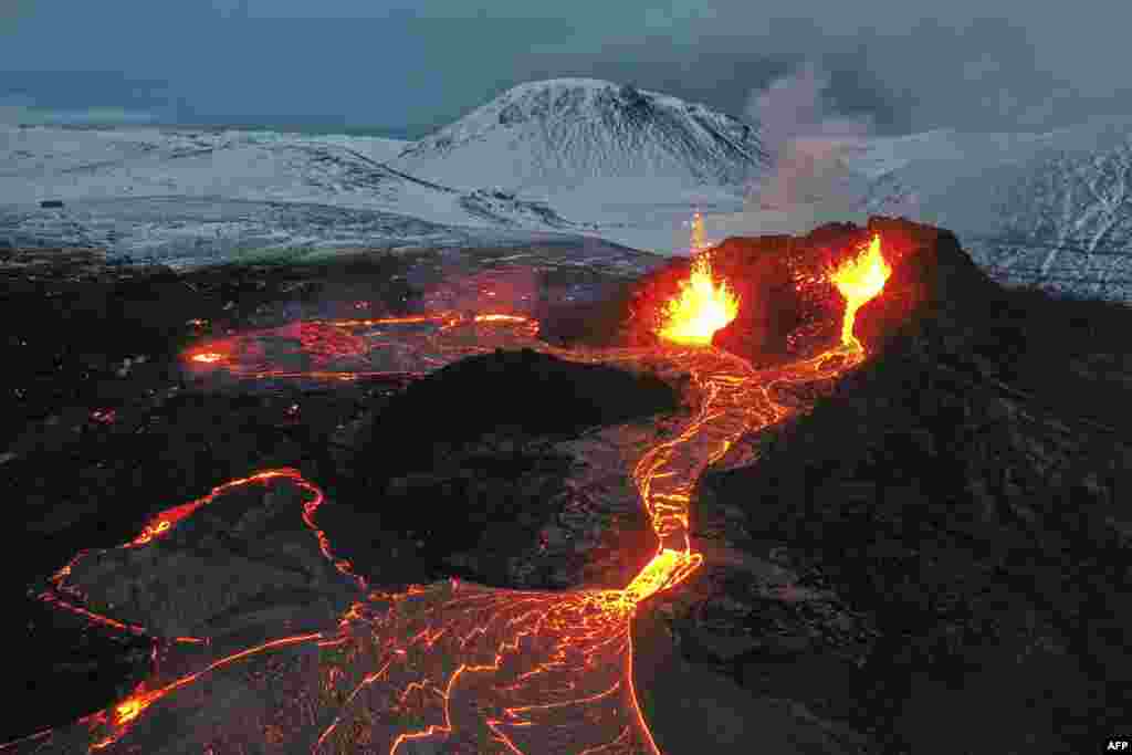 Lava flows from an eruption of a volcano on the Reykjanes Peninsula in Iceland, March 28, 2021.