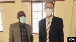 Jeffrey Moyo and lawyer Doug Coltart.