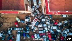 Vehicles pile up in the streets on Nov. 2, 2024, after flooding on Oct. 29 and 30 left hundreds of people dead or missing in Alfafar, Valencia region, Spain, Nov. 2, 2024.