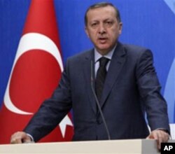 Turkish Prime Minister Recep Tayyip Erdogan speaks to the media during a news conference in Ankara, April 7, 2011