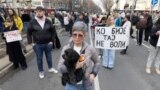 Protestors block the road to pay respects to victims of fatal roof collapse in November 2024 at Novi Sad's railway station, in Belgrade