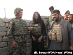 VOA journalist Ayesha Tanzeem visits a police checkpoint in Afghanistan’s Achin district with Colonel Jan Mohammad, left, a local Afghan National Army commander, and Zabihullah Zmaray, right, a Nangarhar provincial council member.