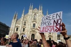 Protesters rally in Piazza Duomo in Milan, Italy, July 24, 2021, against the introduction of a mandatory "green pass" for indoor dining and entertainment areas aiming to limit the spread of the COVID-19.