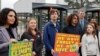 Swedish climate activist Greta Thunberg, second left, joins youths from Portugal during a demonstration outside the European Court of Human Rights Tuesday, April 9, 2024 in Strasbourg, eastern France.