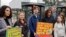 Swedish climate activist Greta Thunberg, second left, joins youths from Portugal during a demonstration outside the European Court of Human Rights Tuesday, April 9, 2024 in Strasbourg, eastern France.
