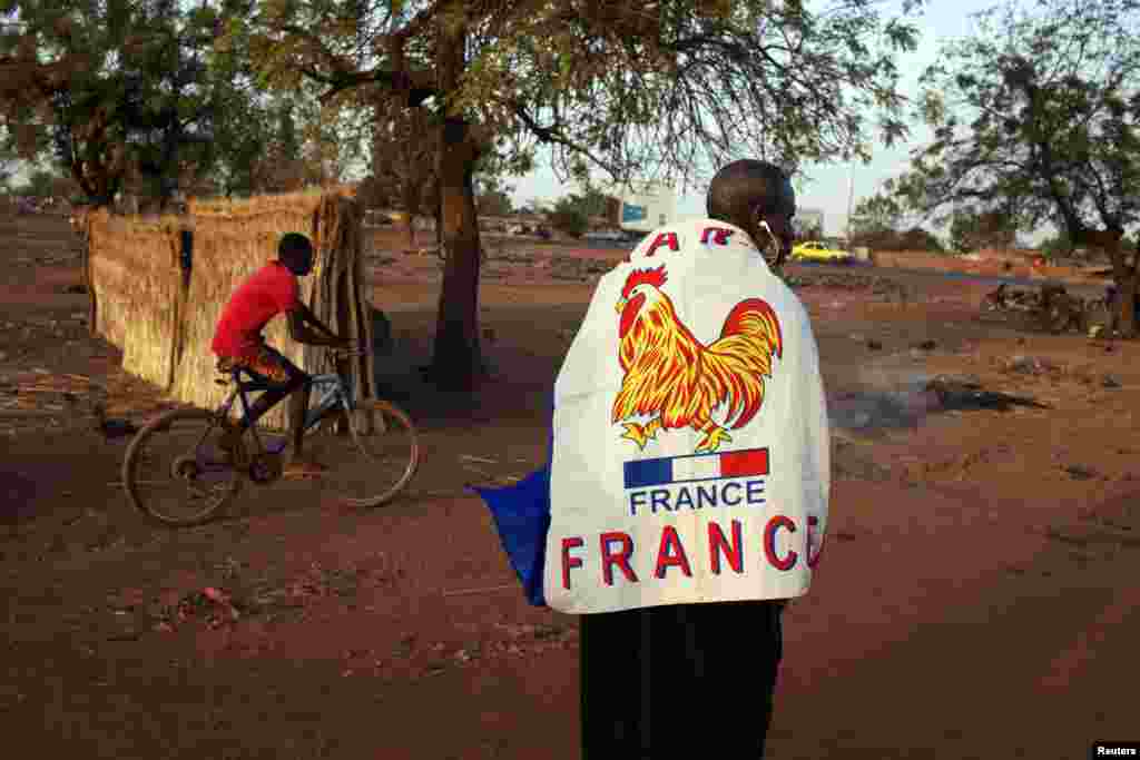 Yacouba Konate, 56, wears a French flag to show his support for the French military intervention in Mali, in the capital, Bamako. 