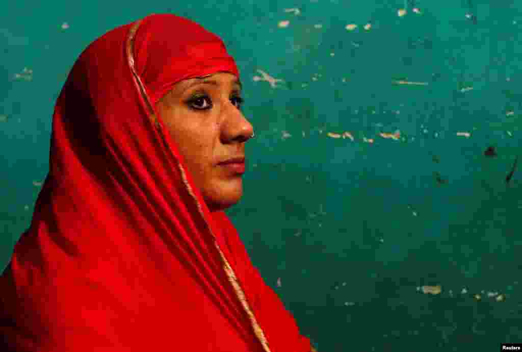 Bouncer Mehrunnisha Shokat Ali offers her evening prayer during holy month of Ramadan at her house in New Delhi, India.