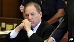 FILE - Harvey Weinstein attends his arraignment in court, in New York on July 9, 2018. 