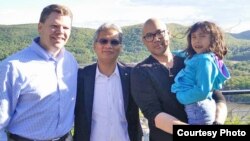 Taylor Tagg (left) Timothy Chhim (middle) and Tony Chhim are pictured in Nanuet, New York, May 14, 2017. The Taggs visited the Chhims for a Buddhist blessing for an operation scheduled for May 25, 2017. (Photo courtesy of Taylor Tagg)