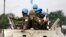 FILE - Peacekeepers serving in the United Nations Organization Stabilization Mission in the Democratic Republic of the Congo (MONUSCO) patrol in their armored personnel carrier, Dec. 20, 2016.