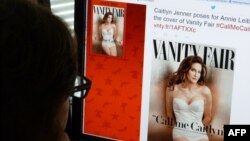 A journalist looks at Vanity Fair's Twitter site with the Tweet about Caitlyn Jenner, the transgender Olympic champion formerly known as Bruce, who will be featured on the July cover of the magazine, June 1, 2015. 