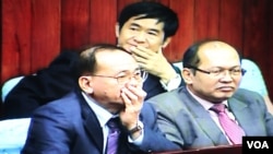 A screen shot from a television monitor showing Hang Puthea (center), a neutral member of election committee, sit in the National Assembly during the election of the National Election Committee at the National Assembly, Phnom Penh, Cambodia. 