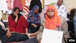 Families describe torture, rapes and kidnappings on the road from their homes in Sudan to Libya on May 4, 2019, in Tripoli, Libya. (Heather Murdock/VOA) 