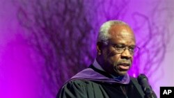  In this Jan. 26, 2012 file photo, Supreme Court Justice Clarence Thomas speaks at College of the Holy Cross in Worcester, Mass. Thomas has asked questions during Supreme Court arguments for the first time in 10 years. Thomas' question came Monday, Feb. 29, 2016. (AP Photo/Michael Dwyer, File)