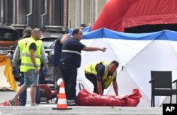 Forensic police work at the scene of a shooting in Liege, Belgium, May 29, 2018.