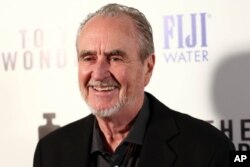 FILE - Wes Craven arrives at the premiere of "To The Wonder" hosted by FIJI Water on Tuesday, April 9, 2013 in Los Angeles.