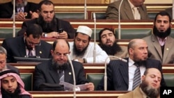 Salafi members of parliament are seen during the first Egyptian parliament session, after a revolution ousted former President Hosni Mubarak, in Cairo, January 23, 2012