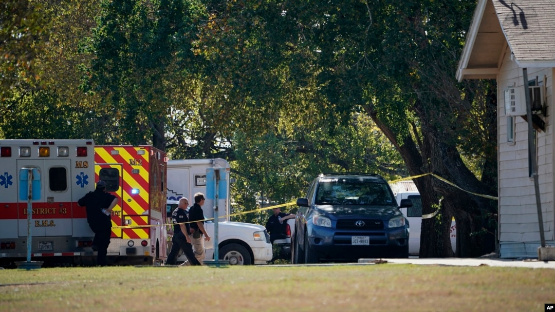 First responders work at the rear of the First Baptist Church of Sutherland Springs in response to a fatal shooting, Nov. 5, 2017, in Sutherland Springs, Texas.