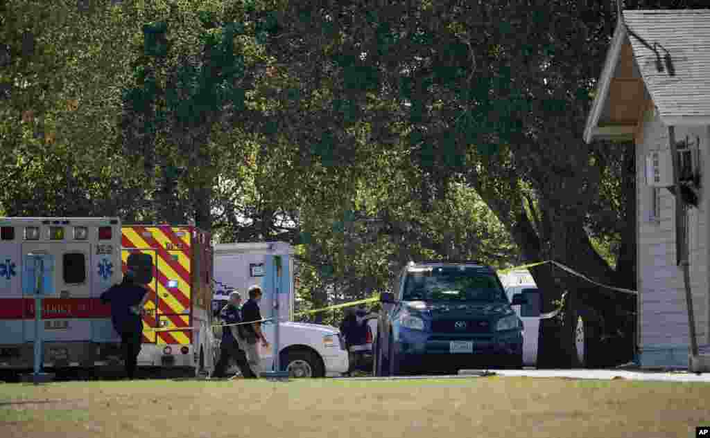 First responders work at the rear of the First Baptist Church of Sutherland Springs in response to a fatal shooting, Nov. 5, 2017, in Sutherland Springs, Texas.