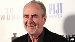 FILE - Wes Craven arrives at the premiere of "To The Wonder," April 9, 2013, in Los Angeles.