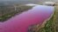 An aerial view shows a lagoon that turned pink due to a chemical used to help prawn conservation in fishing factories, near Trelew, in the Patagonian province of Chubut, Argentina, July 23, 2021.