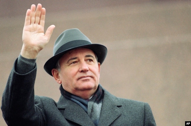 FILE - Soviet President Mikhail Gorbachev waves from the Red Square tribune during a Revolution Day celebration, in Moscow, Soviet Union, Tuesday, Nov. 7, 1989. (AP Photo/Boris Yurchenko, File)