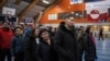 People queue to cast their votes at the polling station during general election in Nuuk, Greenland, March 11, 2025. 