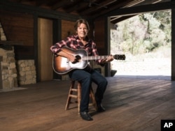 Musician John Fogerty poses for a portrait during an interview about his new memoir "Fortunate Son: My Life, My Music," in Topanga, California, Sept. 24, 2015.