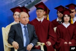 Russian President Vladimir Putin attends the ceremony at which Chinese President Xi Jinping was presented with an honorary degree from St. Petersburg State University at the St. Petersburg International Economic Forum in St. Petersburg, Russia, June 6, 2019.