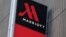 FILE - Signage for the New York Marriott Marquis is seen in Manhattan, New York, Nov. 16, 2015. Marriott International bought Starwood Hotels and Resorts for $13.6 billion on Monday to create the world's biggest hotel chain. 