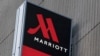 FILE - Signage for the New York Marriott Marquis is seen in Manhattan, New York, Nov. 16, 2015. 