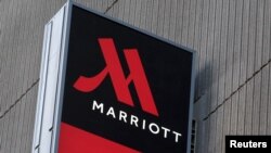 FILE - Signage for the New York Marriott Marquis is seen in Manhattan, New York, Nov. 16, 2015. 