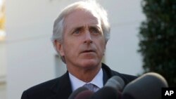 Sen. Bob Corker, ranking Republican on the Senate Foreign Relations Committee, speaks to members of the media following a meeting with President Barack Obama, outside the West Wing of the White House in Washington, Nov. 19, 2013.