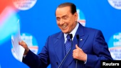 People of Freedom party member Silvio Berlusconi makes an address on stage in Brescia May 11, 2013.