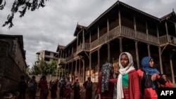 FILE - Students gather in the courtyard of the Sheik Ojele palace, which was built in 1890 and influenced by Indo-Islamic architectural design, and currently used as a residence combined with a school, in Addis Ababa, Nov. 29, 2018.