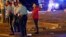 FILE - Police officers interview witnesses, Feb. 25, 2017, at the scene where a vehicle struck a crowd and other vehicles during the Krewe of Endymion parade in New Orleans. Saturday night a car struck a crowd on Esplanade Avenue, near the Endymion parade route.