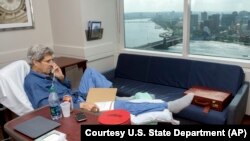 Secretary of State John Kerry speaks to National Security Adviser Susan Rice from his hospital room at Massachusetts General Hospital in Boston, June 9, 2015. The photo was released June 10, 2015.