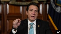 FILE - New York Gov. Andrew Cuomo, seen in this Jan. 2019 file photo, says he's directing state health officials to ban the sale of flavored e-cigarettes, citing the risk of young people getting addicted to nicotine, Jan. 29, 2019. 