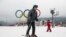 A visitor skis in front of the Olympic rings at the Rosa Khutor ski resort in Sochi, Russia, Jan. 12, 2018. Sochi hosted Olympic skiing in 2014, Russia.