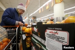 Grapefruit, imported from Turkey according to labels and product information on the box, are on sale at a grocery of the food retailer Dixy in Moscow, Dec. 1, 2015.