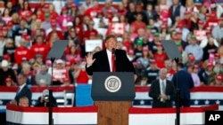 FILE - President Donald Trump speaks during a rally at Southern Illinois Airport in Murphysboro, Ill., Oct. 27, 2018.